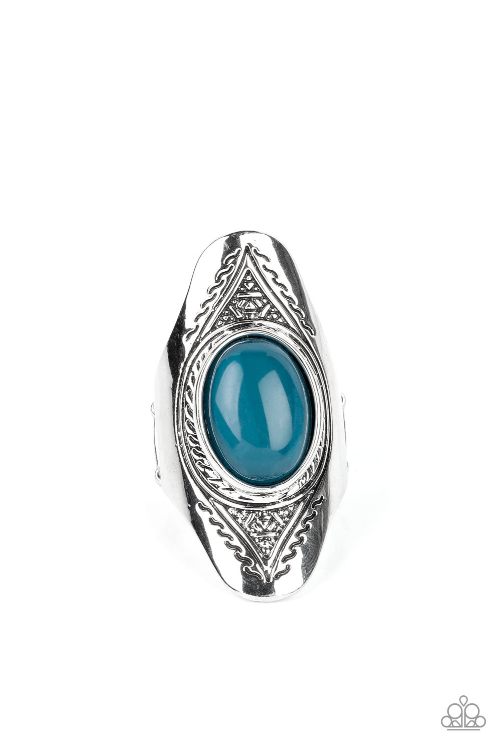 An oversized, glassy, blue bead is pressed into the center of a dramatically elongated silver frame. Triangular patterns are etched into the frame as it folds around the finger, resulting in an ethereal pop of color atop the finger. Features a stretchy band for a flexible fit.