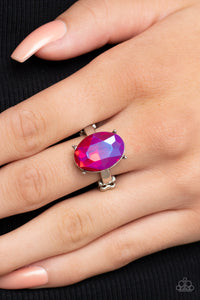 A stunning faceted iridescent pink gem, set in edgy pronged fittings, creates a glamorous show-stopping centerpiece atop sleek silver bands. Features a dainty stretchy band for a flexible fit.