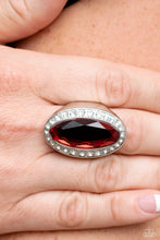 Load image into Gallery viewer, Bordered by a glitzy ring of white rhinestones, an oblong red gem embellishes the center of a dramatically oversized silver frame for a blinding finish. Features a stretchy band for a flexible fit.
