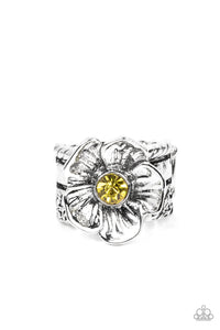 Textured silver petals gently gather around a sparkling yellow rhinestone center, blooming into a dazzling floral centerpiece atop the finger. Features a stretchy band for a flexible fit. 