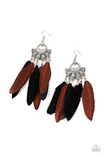 Load image into Gallery viewer, Oversized black and brown feathers swing from the bottom of an ornately hammered and stacked silver frame, resulting in a flirtatiously colorful fringe. Earring attaches to a standard fishhook fitting. 
