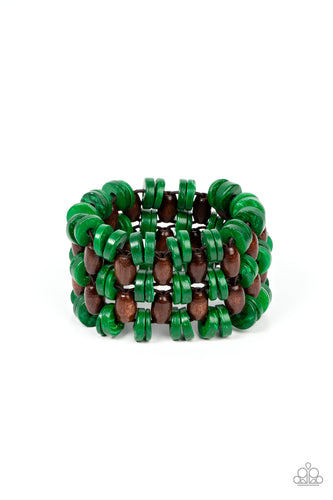 A tropical collection of distressed green wooden discs and brown oval wooden beads are decoratively threaded along stretchy bands around the wrist, creating a refreshing pop of summery fun.