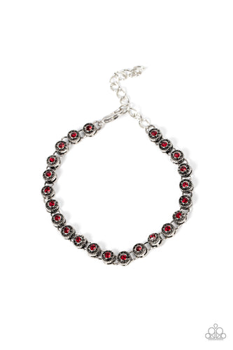 Featuring studded silver fittings, a dainty collection of red rhinestones delicately connects with antiqued silver links for a subtle shimmer around the wrist. Features an adjustable clasp closure.