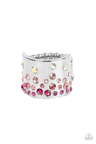 Featuring iridescent and glassy finishes, glitzy rows of pink and multicolored rhinestones are haphazardly sprinkled across the front of a thick silver band for a colorful splash of ombre sparkle. Features a stretchy band for a flexible fit. 