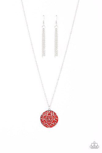 A mandala-like floral motif is embossed across the front of a shiny red frame, resulting in a whimsical pendant at the bottom of a dainty silver chain. Features an adjustable clasp closure. 
