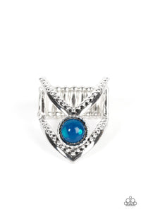 A glassy Mykonos Blue bead balances between arching silver bars featuring smooth and studded details, resulting in an edgy frame around the finger. Features a stretchy band for a flexible fit.