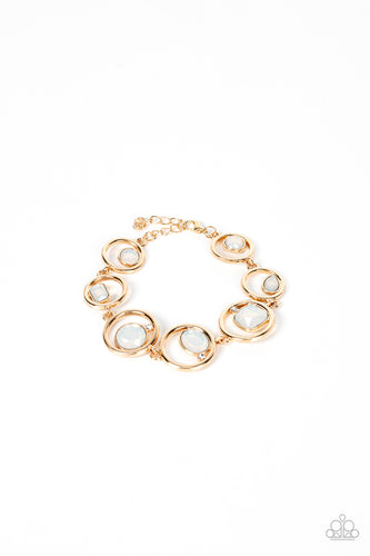 Sporadically infused with dainty white rhinestones, a glittery collection of round, teardrop, and emerald cut opal rhinestones haphazardly adorn the centers of interlocking gold hoops around the wrist for a mesmerizing finish. Features an adjustable clasp closure.