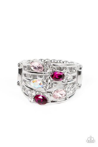 Infused with clusters of dainty white rhinestones, a glitzy collection of Pale Rosette, Fuchsia Fedora, and iridescent rhinestones are sprinkled across layers of silver bands, creating an ethereal sparkle across the finger. Features a dainty stretchy band for a flexible fit.