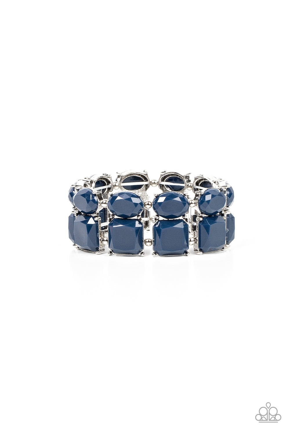 Separated by pairs of dainty silver beads, faceted stacks of oval and square cut blue beads are threaded along a stretchy band around the wrist for a refreshing pop of color.