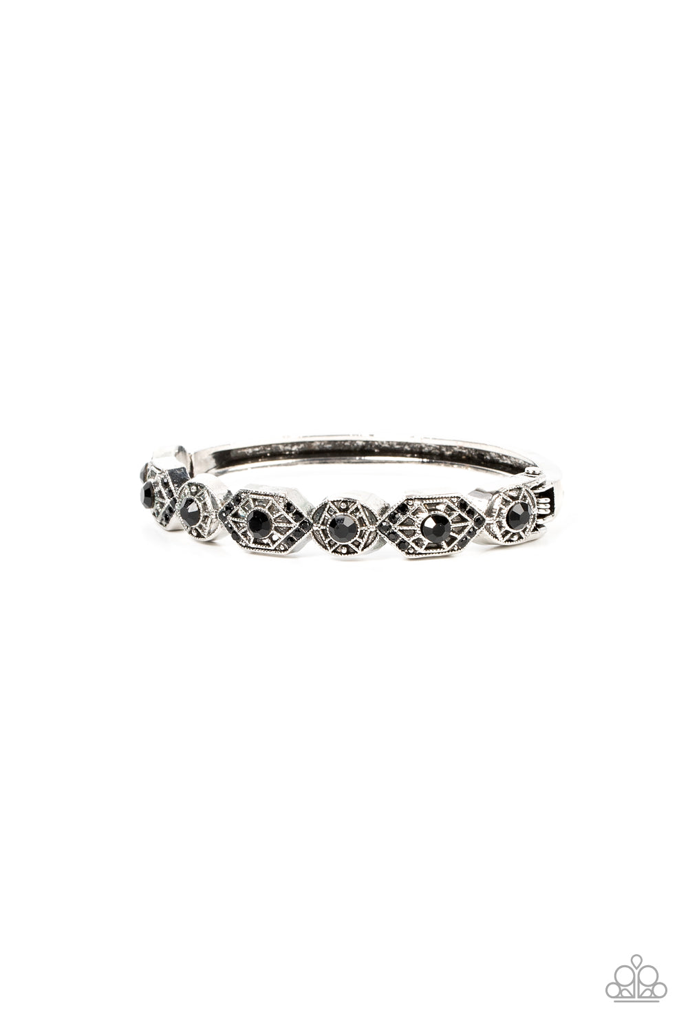 Dotted with dainty black rhinestones, geometrically patterned silver frames alternate across the front of a bangle-like bracelet for an edgy pop of shimmer. Features a hinged closure. 