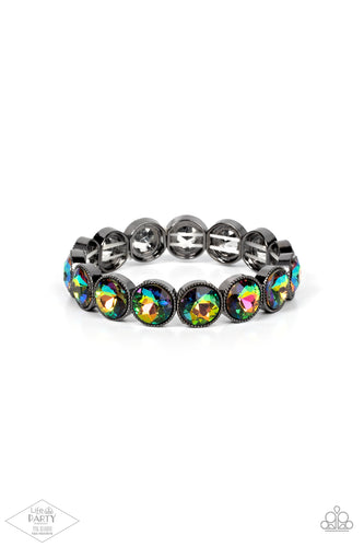 Faceted oil spill gems are pressed into sleek gunmetal frames. The glittery frames are threaded along stretchy bands, creating a glamorous look around the wrist.