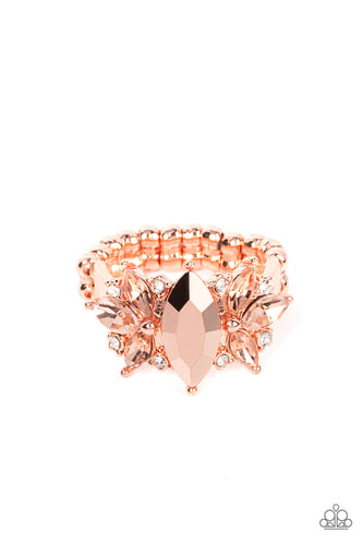An effervescent collection of dainty white rhinestones and marquise cut coppery rhinestones fans out from the sides of a marquise cut coppery aurum gem, exploding into a jaw-dropping centerpiece atop the finger. Features a dainty stretchy band for a flexible fit.
