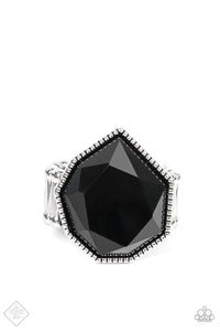 A sleek black bead featuring sharp geometric angles and a defaced surface is pressed into a studded silver frame. The faceted edges catch and reflect the light for an edgy centerpiece atop the finger. Features a stretchy band for a flexible fit.  Sold as one individual ring.  New Kit Fashion Fix