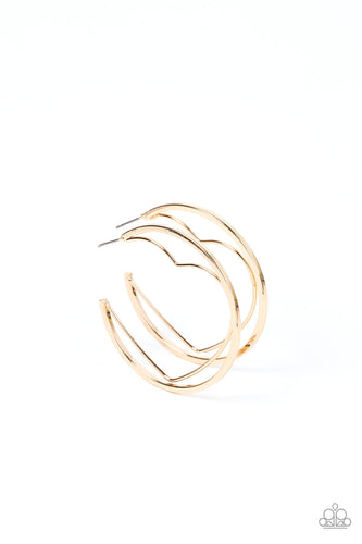 A gold wire heart is encircled in an oversized gold hoop, resulting in a heart-stopping shimmer. Earring attaches to a standard post fitting. Hoop measures approximately 2