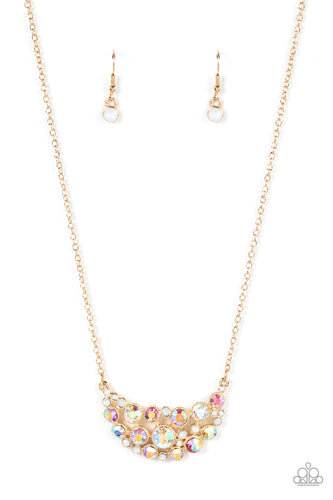 An effervescent collection of opal and iridescent rhinestones delicately join into a bubbly half moon pendant at the bottom of a dainty gold chain, resulting in a sparkly statement piece below the collar. Features an adjustable clasp closure. 