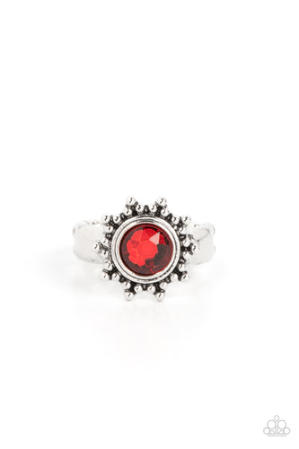 Dainty silver studs radiate out from an oversized red rhinestone center, resulting into a radiant sunburst frame atop the finger. Features a dainty stretchy band for a flexible fit. 