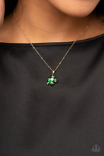 Load image into Gallery viewer, Sparkling with glittery green rhinestones, a golden clover pendant glides along a dainty gold chain below the collar for a dazzling dash of St. Patrick&#39;s Day inspiration. Features an adjustable clasp closure.  Sold as one individual necklace. Includes one pair of matching earrings.
