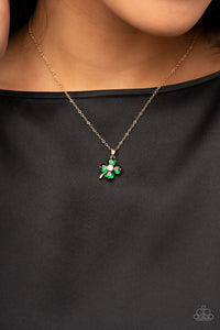 Sparkling with glittery green rhinestones, a golden clover pendant glides along a dainty gold chain below the collar for a dazzling dash of St. Patrick's Day inspiration. Features an adjustable clasp closure.  Sold as one individual necklace. Includes one pair of matching earrings.