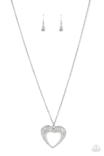 A flared silver heart is encrusted in glassy white rhinestones, resulting in a romantic shimmer at the bottom of an extended silver chain. Features an adjustable clasp closure. 