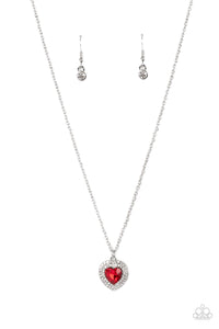 Bordered in stacked rows of glassy white rhinestones, a fiery red heart shaped gem sparkles at the center of a dainty silver chain for a flirtatious fashion. Features an adjustable clasp closure. 