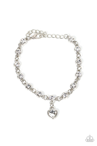 A white rhinestone heart charm dances from a strand of white rhinestones, resulting in a flirtatious sparkle around the wrist. Features an adjustable clasp closure.  Sold as one individual bracelet.