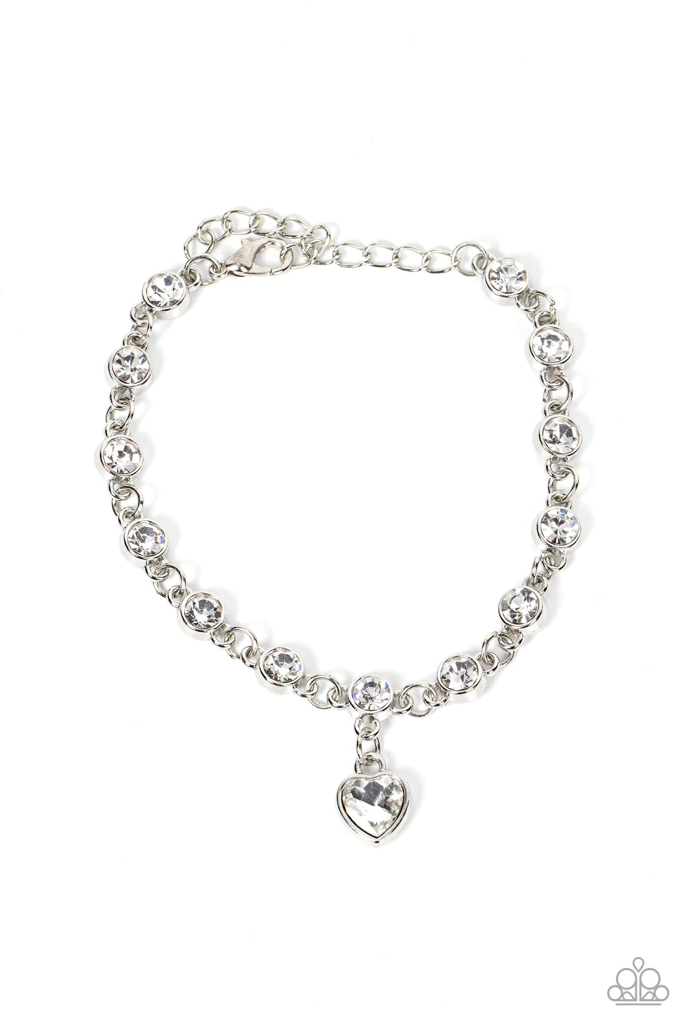 A white rhinestone heart charm dances from a strand of white rhinestones, resulting in a flirtatious sparkle around the wrist. Features an adjustable clasp closure.  Sold as one individual bracelet.
