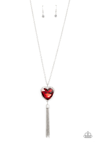 Bordered in a ribbon of glassy white rhinestones, an oversized red heart-shaped gem seemingly floats at the bottom of an extended silver chain. A shimmery silver chain tassel dances from the bottom of the sparkly pendant for a flirtatious finish. Features an adjustable clasp closure. 