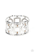 Load image into Gallery viewer, Dotted with dainty topaz rhinestones, an airy collection of hammered circular and rectangular frames glides along stretchy bands around the wrist. The geometric frames are separated by trios of dainty silver cube beads, adding extra edge to the textured display.
