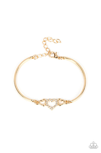 Two shiny gold hearts flank a white rhinestone dotted heart at the center of two curved gold bars, linking into a flirtatious centerpiece around the wrist. Features an adjustable clasp closure. 