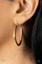 Load image into Gallery viewer, A glistening gold bar sharply curves into an asymmetrical hoop, adding a flash of high sheen luster to any outfit. Earring attaches to a standard post fitting. Hoop measures approximately 1 1/4&quot; in diameter.  Sold as one pair of hoop earrings.  New Kit Fashion Fix
