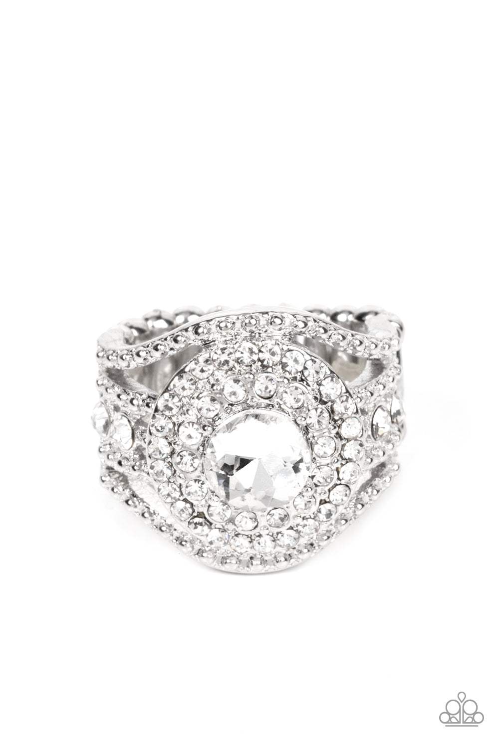 Bordered in stacked rings of glassy white rhinestones, a brilliant white gem sits atop layers of silver studded bars that swoop and stack into blinding bands across the finger. Features a stretchy band for a flexible fit.