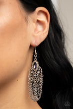 Load image into Gallery viewer, A marquise cut purple rhinestone is pressed into a scalloped silver frame atop a circular silver frame abloom with vine-like filigree. Dotted in dainty white rhinestones, the decorative frame gives way to a fringe of silver chains for a whimsical finish. Earring attaches to a standard fishhook fitting.
