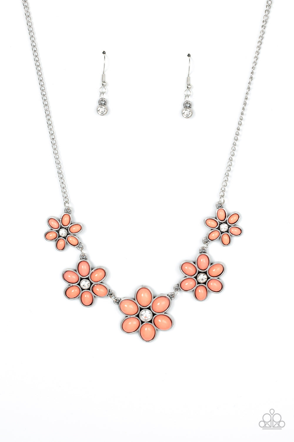 Dotted with dainty white rhinestone centers, a flirtatious assortment of coral beaded flowers gradually increase in size as they link below the collar for a playful pop of color. Features an adjustable clasp closure.