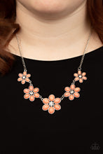 Load image into Gallery viewer, Dotted with dainty white rhinestone centers, a flirtatious assortment of coral beaded flowers gradually increase in size as they link below the collar for a playful pop of color. Features an adjustable clasp closure.
