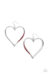 A section of fiery red rhinestones adorns a curvaceous silver heart frame, resulting in a heart-stopping sparkle. Earring attaches to a standard fishhook fitting.