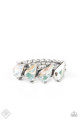 A row of brilliant white teardrop rhinestones encased in silver pronged fittings are tilted on an angle as they connect across the finger making an impressive swoon-worthy statement. Features a dainty stretchy band for a flexible fit.  Sold as one individual ring.  New Kit Fashion Fix