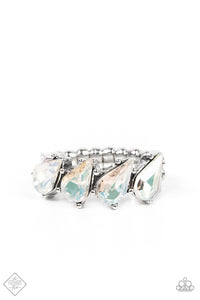 A row of brilliant white teardrop rhinestones encased in silver pronged fittings are tilted on an angle as they connect across the finger making an impressive swoon-worthy statement. Features a dainty stretchy band for a flexible fit.  Sold as one individual ring.  New Kit Fashion Fix