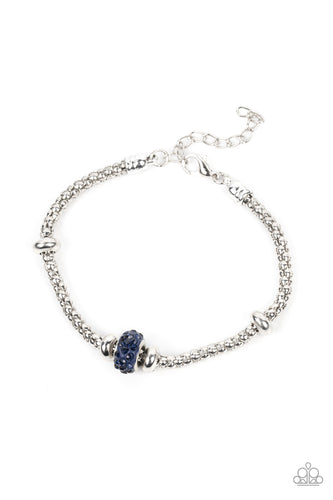 Flanked by silver disc-like beads, a blue rhinestone dotted bead adorns the center of a silver popcorn chain around the wrist for a dazzling finish. Features an adjustable clasp closure.