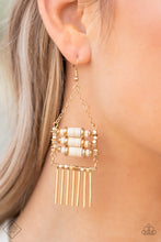 Load image into Gallery viewer, Three rows of earthy white stone discs and gold beads are stacked inside a frame of shimmery square gold beads. A fringe of shiny gold bars falls from the bottom of the square frame that is suspended from gold chains, allowing the pieces to sway freely. Earring attaches to a standard fishhook fitting.
