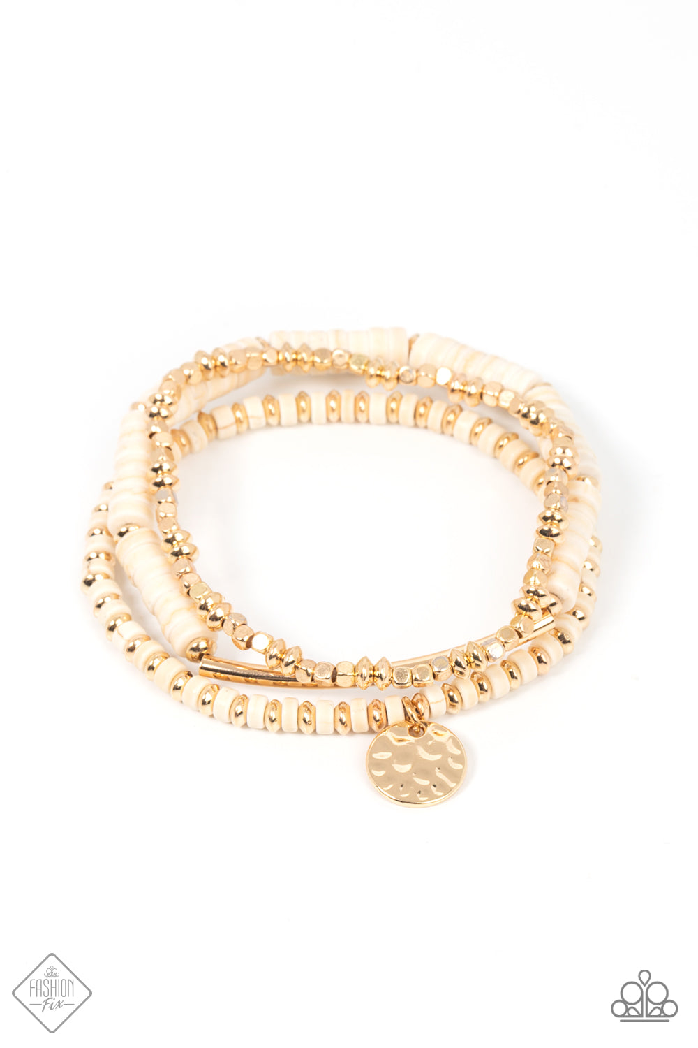 A collection of shiny gold square and oval beads, earthy white stone discs, a hammered gold disc, and a curved gold cylinder, are threaded along stretchy bands, making three distinctive designs that create a trendsetting display as they stack up the wrist. 