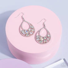 Load image into Gallery viewer, Featuring square, marquise, teardrop, and round cuts, an effervescent collection of white and iridescent rhinestones delicately collects along the bottom of a studded silver teardrop for a bubbly finish. Earring attaches to a standard fishhook fitting. 
