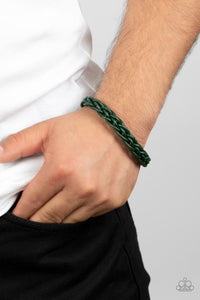 Leathery green cords intricately weave around the wrist, creating a rustic braid. Features a magnetic closure.