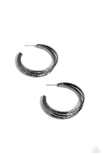 Load image into Gallery viewer, Stamped in zigzagging textures, two textured gunmetal bars flank a smooth gunmetal bar as they curve into a layered hoop. Earring attaches to a standard post fitting. Hoop measures approximately 1 3/4&quot; in diameter. 
