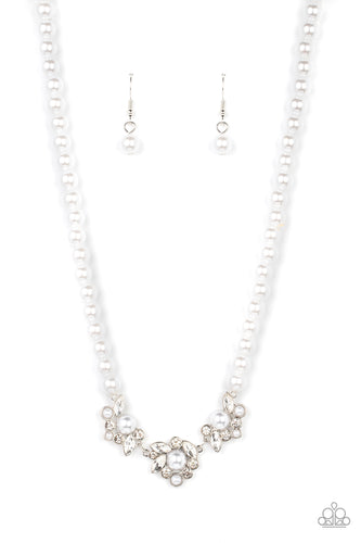 A bubbly collection of white pearls, round rhinestones, and marquise cut rhinestones delicately cluster into effervescent frames at the center of a classic strand of white pearls, resulting in a timeless centerpiece. Features an adjustable clasp closure. 
