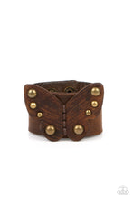 Load image into Gallery viewer, Dotted with antiqued brass studs, a distressed leather butterfly is studded in place across the center of a distressed brown leather band for a rustic flair. Features an adjustable snap closure.
