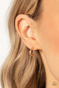 Two flat rose gold bars delicately curve into a single hoop, creating a dainty layered look. Earring attaches to a standard post fitting. Hoop measures approximately 1/2" in diameter.