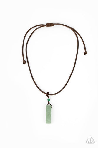 A rectangular jade stone pendulum is knotted in place below a dainty jade stone bead that glides along a shiny brown cord below the collar, resulting in an earthy pendant. Features an adjustable sliding knot closure.