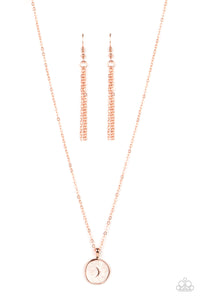 Painted in a shimmery white lacquer finish, an asymmetrical shiny copper disc is dotted in a dainty shiny copper moon accent as is swings from the bottom of a dainty shiny copper chain below the collar for an enchanting finish. Features an adjustable clasp closure. 