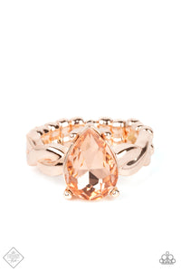 A luxurious peach teardrop gem sits regally atop a twisted rose gold band, creating a stunning centerpiece atop the finger. Features a dainty stretchy band for a flexible fit.  Sold as one individual ring.  New Kit Fashion Fix