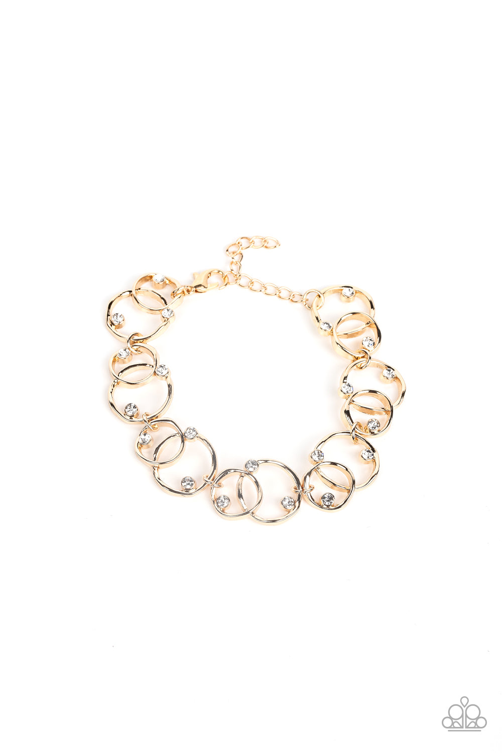 Sporadically dotted in glassy white rhinestones, asymmetrical pairs of overlapping gold rings delicately link around the wrist for a dizzying display of industrial refinement. Features an adjustable clasp closure.